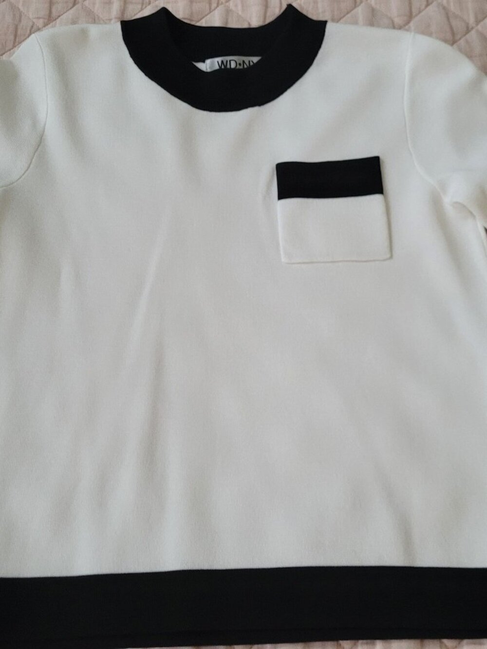 Cream with black trim short sleeve size small sweater-type top.